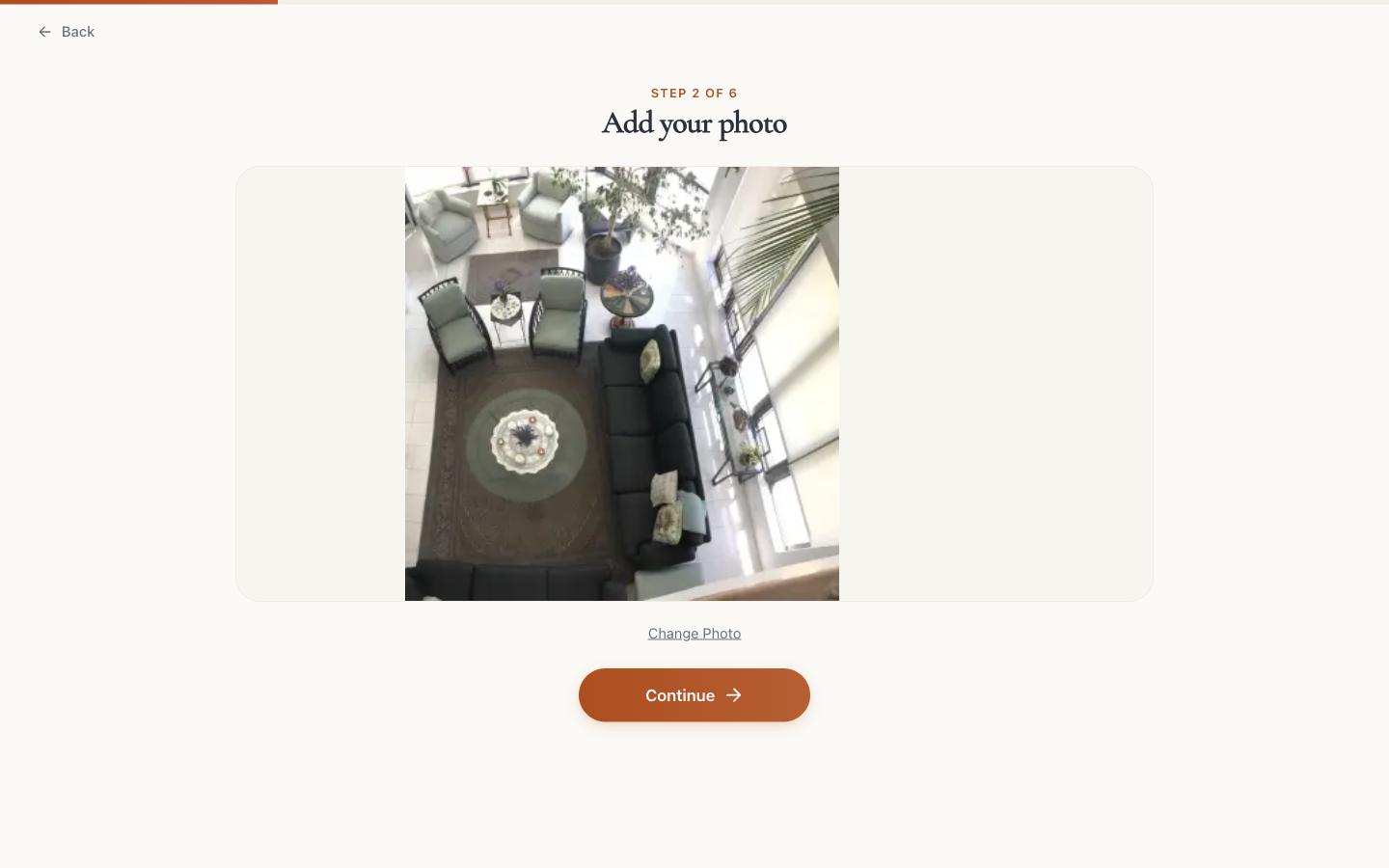 Visualizer step 2 of 6, “Add your photo”, with an uploaded room photo and continue action, captured April 14, 2026.